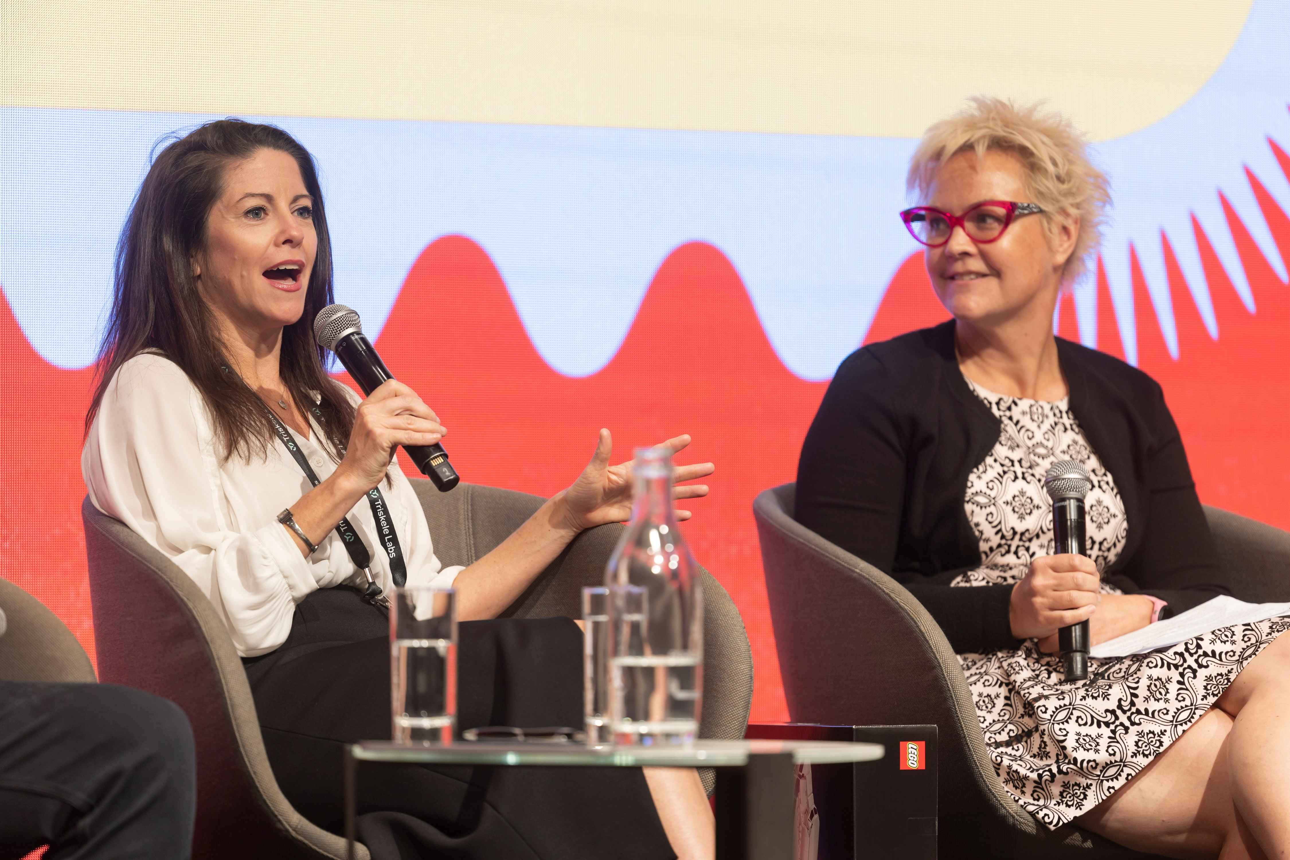An animated discussion at CyberWest Summit 2025 between Clare Mould and Shana Uhlmann.