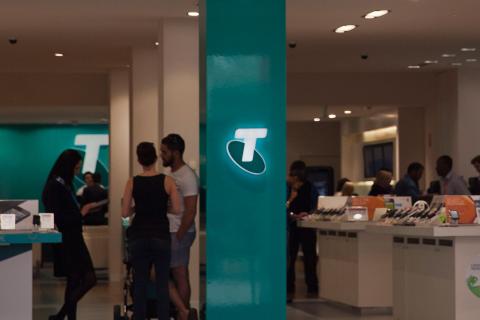 Telstra dividend cut as profit falls 5% in first half