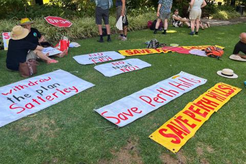 Save Perth Hills continue to oppose Satterley Group's plan during a protest at Supreme Court Gardens. 