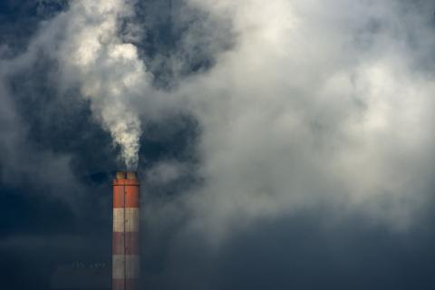 Smoke coming out of a chimney.