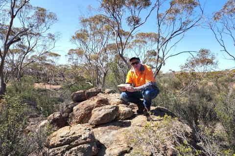 Ron Mitchell on a rock
