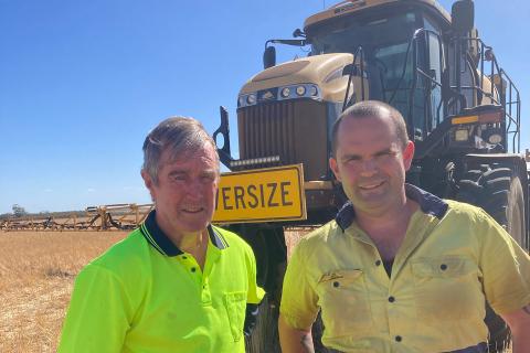Ian and Callum Clarke in front of their boomspray. Photo: RSM