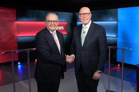 Anthony Albanese and Peter Dutton shake hands before the debate. Photo: AAP / ABC pool.