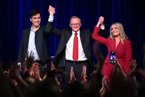 Anthony Albanese celebrates with son Nathan and partner Jodie Haydon. Photo: AAP/Dean Lewins