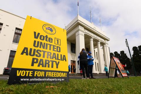 A corflute sign for the United Australia Party is seen outside the Australian Electoral Commission early voting centre in the Federal electorate of Chisholm at the Box Hill Town Hall in Melbourne, Friday, May 13, 2022. (AAP Image/James Ross).
