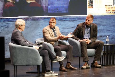 Aiden Morrison (centre) speaks alongside Chris Keefer (right) and panel moderator Tom Switzer this morning. Photo: Diggers & Dealers
