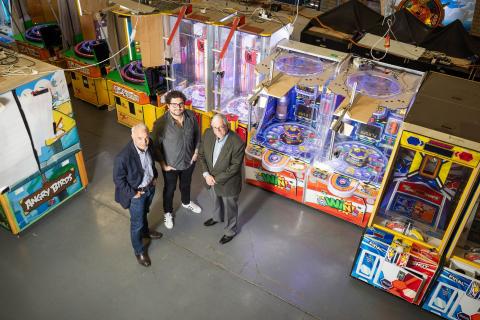 Adam Steinberg (left), Shannon Perell and Malcolm Steinberg at their ArcadeXR games warehouse. Photo: Michael O’Brien
