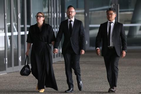 State Labor secretary Mark Reed arriving at the service with partner Brighita Algeri (left) and Cannington MP Ron Sao. Photo: Michael O'Brien.