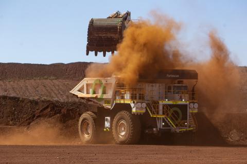 An electric digger loads up a battery-electric haul truck at a Fortescue mine in the Pilbara. Photo: Tom Zaunmayr