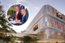 Peter Bennett and Roger Cook signing the $1.8 billion contract. 