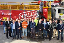 WA Premier Roger Cook and BHP WAIO asset president Tim Day with ministers and Wallis Drilling staff.
