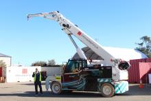 Maurizio Manzini with Monadelphous' first electric crane. Photo: Nadia Budihardjo