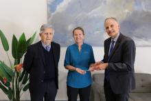 C/Prof David Blacker (right) handing Prof Merrilee Needham (middle) a reflex hammer and Prof Frank Mastaglia (Prof Needham's mentor and clinic founder, left) in the Perron Institute clinic.