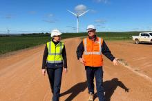Amber-Jade Sanderson with Bright Energy’s Tom Frood at the Warradarge wind farm.