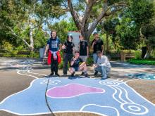 Youth working on the murals,bollards and planted greenery, transforming Wright Street into a coherent visual narrative reflecting local identity and connection.