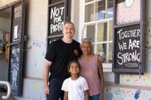 Sean-Paul Stephens, Skylah Tucker, 9, and Belinda Churnside at the general store. Photo: Tom Zaunmayr