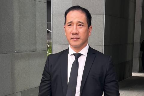 Michael Le leaving the Supreme Court.